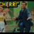 Pixelated image showing a person in dark clothing with arms crossed, standing against a green background with yellow text reading 'THERE!' at the top left.