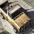 Static 48x48 pixel icon depicting a stylized military vehicle with visible armor plating and angular design elements on a neutral background.