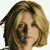 Static pixelated image of a person's face with shoulder-length hair, visible in 256x256 pixels on a transparent background.