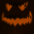 A Halloween-themed animated icon with a smiling pumpkin face, orange eyes and mouth on dark background, displaying 'Happy Halloween' text.