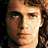 Six pixelated frames show a character in light brown hair and gray robes against dark backgrounds, with changing head positions from front to side views.