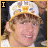 A pixelated of six showing a person in a white cap with yellow and blue patterns, smiling across different text overlays