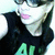 A person wearing a black sleeveless shirt with green text, dark sunglasses, and pink lips appears in four showing slight head movement
