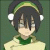 Pixelated character with dark hair, green headband, white ear accessories, and green-and-white clothing against a dark green background.