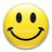Yellow circular smiley face with black eyes and mouth on white background, adjacent to cyan with text