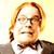 Animated contact sheet showing two frames of a person with red hair and glasses in formal attire alongside a blue background with "CoolBuddy.com" text.