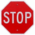 Red octagonal stop sign with white text 'STOP' on left; right version adds black-and-white pixelated text 'In the name of LOVE' over red background.