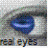 A pixelated close-up of a blue eye with visible eyelid and surrounding skin, accompanied by partially obscured text below.