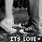 Black-and-white image of two people's lower legs and feet standing on grass, with text "ITS LOVE" below them.