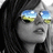 Pixelated close-up of a person with dark hair wearing reflective sunglasses showing a blue sky and green landscape reflection.