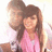 Pixelated image of two people in a close pose with one person's arm around the other, set against a bright background.