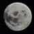 A pixelated moon image with multiple text overlays in green, purple, and blue on a black background with small colored dots.