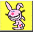 Pixelated pink rabbit with blue eyes and red cheeks on yellow background, next to cyan text reading KISS MY ASS on black background.