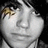 A static image with a red background, featuring a grayscale photo of a person's face on the left and yellow pixelated text on the right.