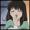 Anime-style character with dark brown hair and bangs, wearing a green top with white striped sleeves, smiling with closed eyes and hands near face.