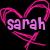 Pixelated pink heart outline with 'sarah' text inside on black background, rendered in low-resolution digital style.
