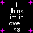 Black background with white text reading "i think im in love... <3" surrounded by purple plus signs, two identical static frames side-by-side.