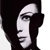 Pixelated profile of a person with dark hair and light skin, facing left, against a white background.