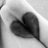 Black-and-white heart-shaped hand gesture on left, red background with pixelated text and symbols on right.