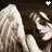A grayscale animated icon shows a figure with long hair covering their face, then lowering the hair to reveal a smiling expression.