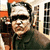 A pixelated image of a person with a bandaged head and dark sunglasses, wearing a dark jacket, with a green text label reading 'fnstein' below.