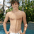 A pixelated image of a shirtless man standing outdoors with hands on hips, next to a bright pink background with green text.