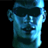 Pixelated blue-toned static icon of a stylized human face with dark sunglasses, rendered in low-resolution 256x256 pixels against black background.