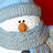 Pixelated snowman icon with red hat, white face, orange carrot nose, and black eyes, set against a blue sky background.