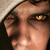 Pixelated close-up of a person's face showing the right eye, nose, and part of the forehead with brown hair visible.