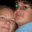 Two people in close embrace, one wearing light blue clothing, with cyan text appearing and changing above them.