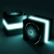 Pixelated teal and black abstract shape with glowing white edges on a dark background.