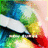 Pixelated abstract composition with blended green, blue, white, yellow, red, and black color blocks forming an indistinct shape against a light pink background.