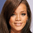 Pixelated close-up of a person with long brown hair, light skin, and a neutral expression against a gradient background.
