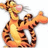 Pixelated tiger character with orange and brown stripes, yellow underbelly, pink nose, and open mouth on white background, with yellow pixelated text on black background.