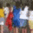 Animated sequence showing a group of people in red, blue, and white clothing with a large star graphic transitioning to a close-up of the star.