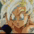 Animated sequence of a character with spiky white hair and black shoulder pads, showing eye closure and head tilt changes.