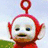 Pixelated image of a red Teletubby character with white face and blue eyes, set against light background with green patch; text "Po Loves" on red above and "FOX LANE" below