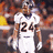 Pixelated image of a football player in white uniform with number 24, orange text 'champ' and 'bailey', dark blue and gray background.