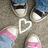 Pixelated image of feet in sneakers with a heart symbol, paired with text overlays on black and gray backgrounds.