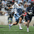 Pixelated image of athletes on a field with orange background and blue text reading "Guys who play LAX are HOT!!!"