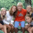 Group photo of people outdoors with text 'Camp ' ' on a cyan background