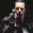 A pixelated image of a man holding a pistol with three skull symbols below him, one labeled 'THE PUNISHER' in white text.