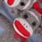 A gray sock monkey with red accents and black eyes appears in a pixelated image, accompanied by red "Ha" text on a black background.