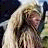 A 4-frame animated contact sheet showing a pixelated image of a person with long blonde hair and text fragments arranged in a grid layout.