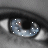 A close-up of a blue eye with white dots scattered across the iris, showing subtle animation changes in dot positions.