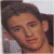 Pixelated image of a person with dark hair and light skin, next to red text on black background reading 'hes so fine!' with four red stars.