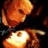 Pixelated image of a person holding an object with text 'Phantom Of The Opera <3 O.G.' on dark green background.
