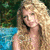A pixelated image of a woman with long blonde hair in an outdoor setting, next to blue text on a dark background.