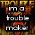Pixelated image with fiery background and bold text overlays reading "im a trouble maker" and "not a double taker bitch!"