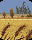 Pixelated landscape with blue sky, brown trees, and gray castle-like structures above a yellow field with brown reeds.